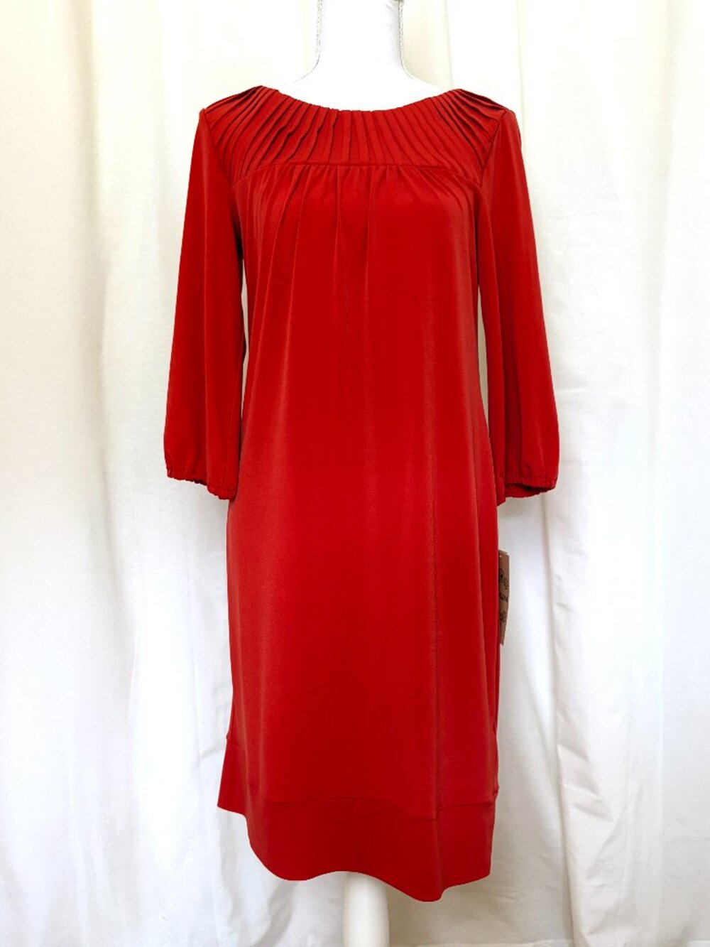 Flattering boat neck dress with pleated details